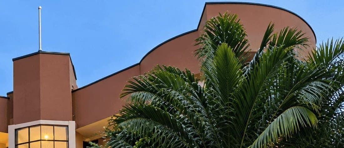 The curved roofline of the hotel